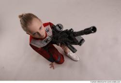 DENISA KNEELING POSE WITH GUN